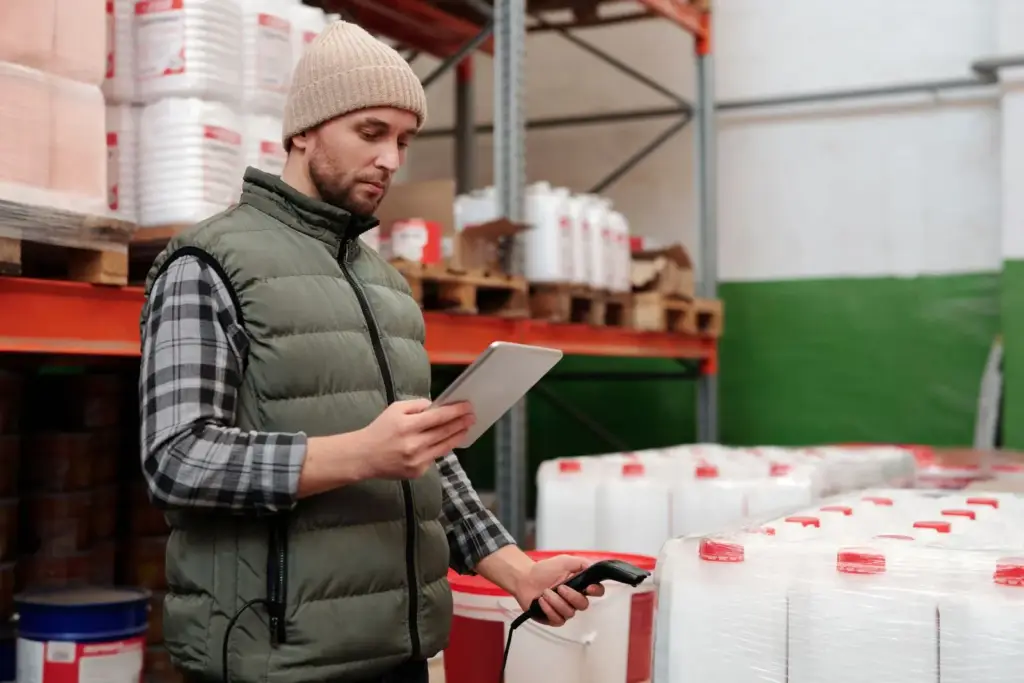 Warehouse worker scanning inventory with tablet at BLB New Jersey fulfillment center
